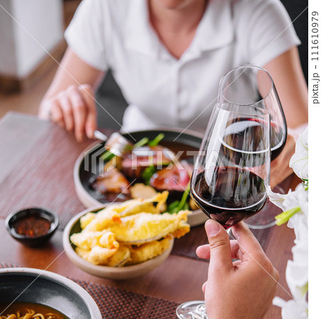 Man and woman drinking red wine in the restaurant Man and woman drinking red wine in the restaurant 111610979