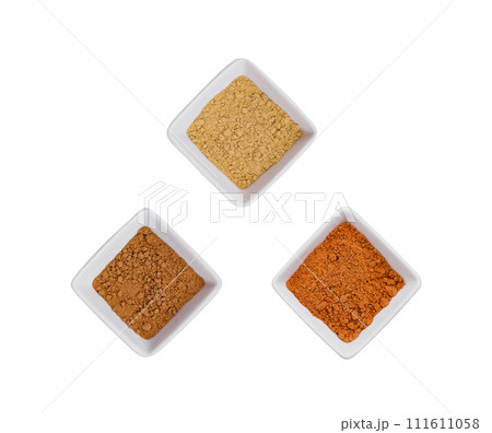 Various Indian Spices in Small White Bowls on white background 111611058
