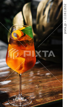 Glass of Aperol Spritz cocktail on the table 111611632