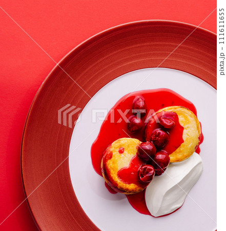 Cottage cheese pancakes with berry jam and sour cream Cottage cheese pancakes with berry jam and sour cream 111611655