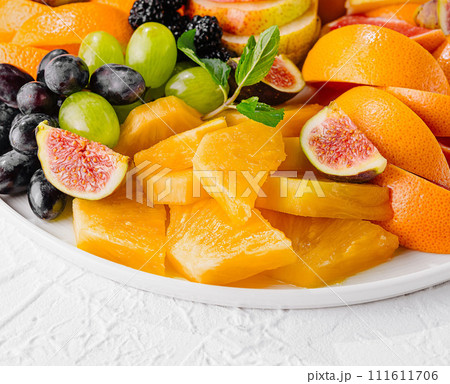 Exotic fruits platter isolated on white 111611706