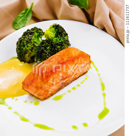 grilled salmon fillet steak with broccoli grilled salmon fillet steak with broccoli 111611737