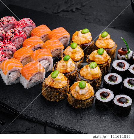 Sushi set on black slate top view Sushi set on black slate top view 111611813