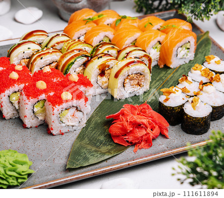 Different kinds of rolls stand on a stone plate 111611894