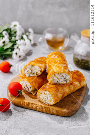 Cooking traditional pies with cottage cheese on wooden table Cooking traditional pies with cottage cheese on wooden table 111612314