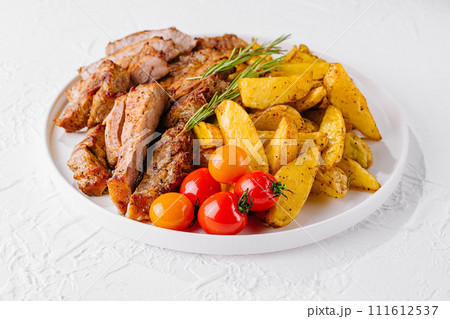 Grilled kebab pork meat with roasted potato and vegetables 111612537