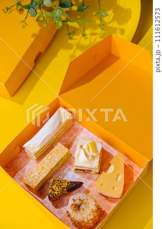 Christmas gifts presents with different cakes on yellow box 111612573