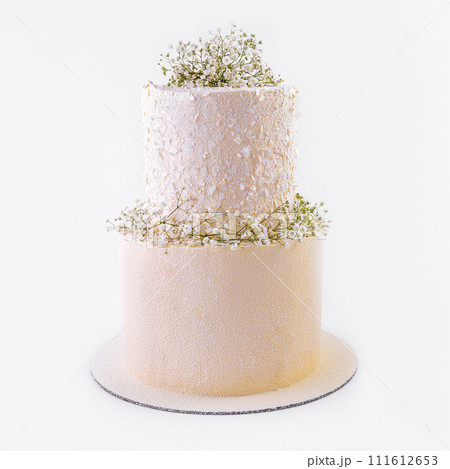 Beautiful multi-tiered wedding cake with flowers Beautiful multi-tiered wedding cake with flowers 111612653