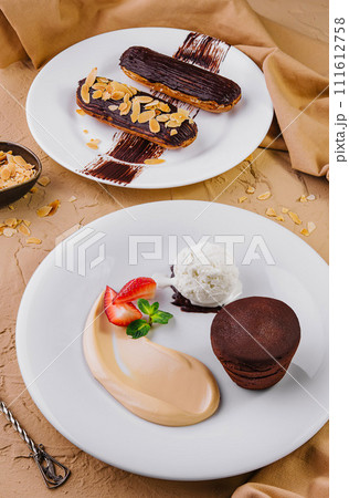 lava cake with ice cream and chocolate eclairs 111612758