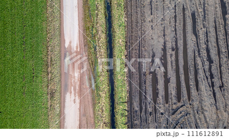 Aerial Contrast: Verdant Fields Beside Plowed Soil Aerial Contrast: Verdant Fields Beside Plowed Soil 111612891