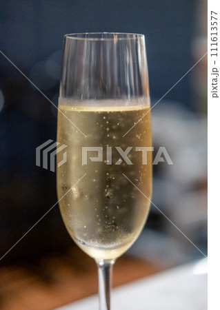 A glass of Prosecco or sparkling wine on the table A glass of Prosecco or sparkling wine on the table 111613577