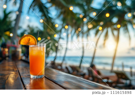 Tropical cocktail on a beach cafe table. Refreshing fruit cocktail on luxury tropical beach resort. Party, summer vacations, holidays, summertime, exotic alcohol drinks. Summer vibes, beach tourism 111615898