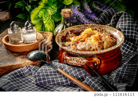 Pea soup with pieces of white sausage, potatoes and small dumplings. Pea soup with pieces of white sausage, potatoes and small dumplings. 111616113