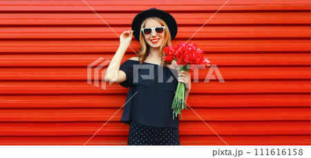 Beautiful happy smiling woman with bouquet of red rose flowers 111616158