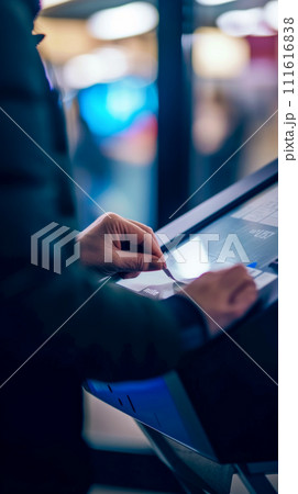 Vertical poster, voting at polling station using electronic machine, importance of voting Vertical poster, voting at polling station using electronic machine, importance of voting 111616838