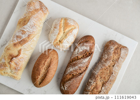 Assorted bakery products including loafs of bread 111619043