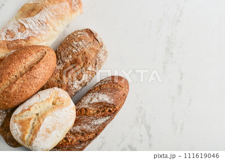 Assorted bakery products including loafs of bread 111619046