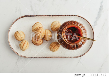 Homemade walnut shaped cookies with boiled condensed milk Homemade walnut shaped cookies with boiled condensed milk 111619375