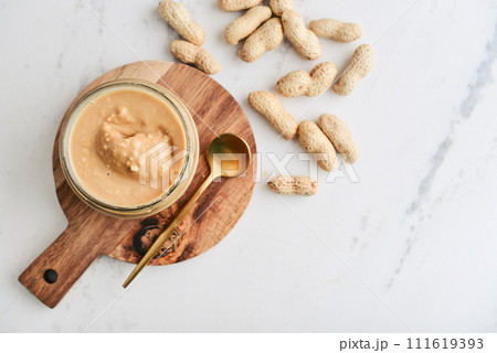 Creamy and smooth peanut butter in jar 111619393