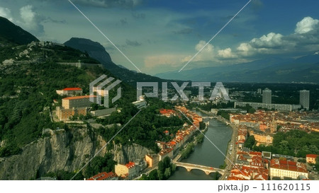 Aerial iconic shot of historic part of Grenoble involving famous Telepherique, a ropeway to Bastille Fort, France 111620115