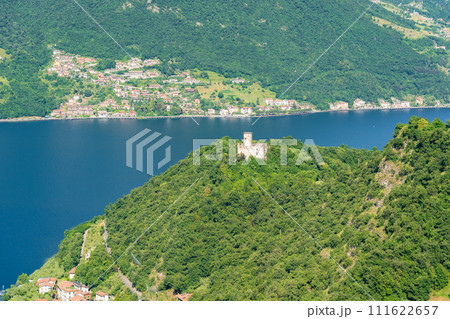Mountain landscape, picturesque mountain lake in the summer morning, large panorama. Iseo, Italy Mountain landscape, picturesque mountain lake in the summer morning, large panorama. Iseo, Italy 111622657