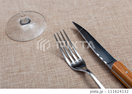 Fork and knife - cutlery on banquet table closeup Fork and knife - cutlery on banquet table closeup 111624132