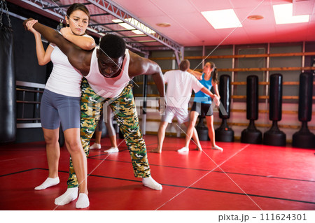 Active woman training captures on self-defense course 111624301