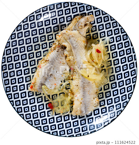 Herring fillet is cooked with spicy salt curing and complemented with pieces of bran bread Herring fillet is cooked with spicy salt curing and complemented with pieces of bran bread 111624522
