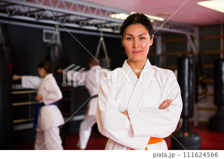 Asian woman in kimono standing with crossed arms 111624566