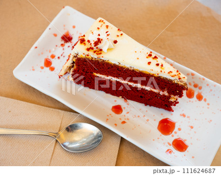Piece of red velvet cake served on saucer Piece of red velvet cake served on saucer 111624687