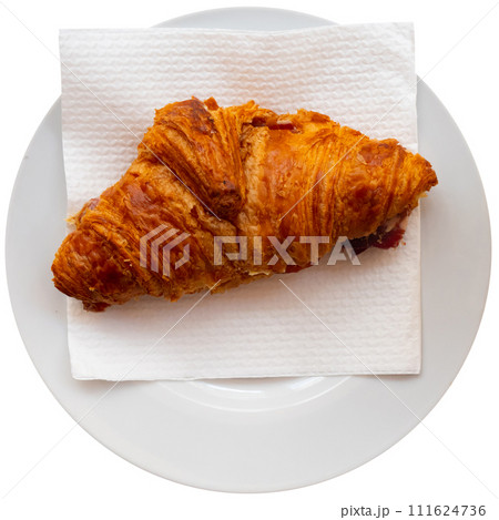Croissant with ham served on platter 111624736
