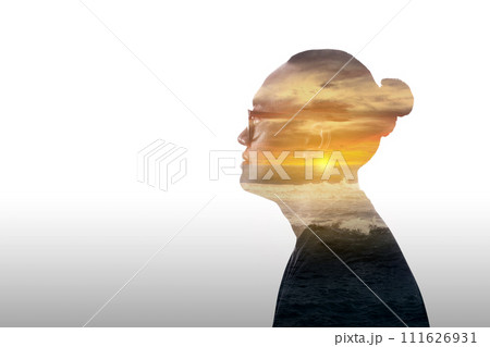 Double exposure image of a young man and sunset over the ocean 111626931