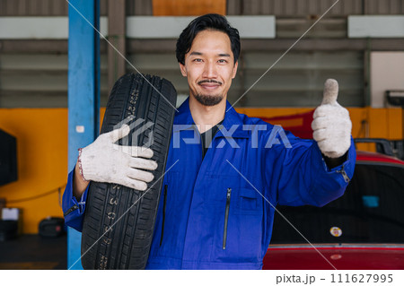Asian Japanese male mechanic worker portrait in auto service workshop car tyre maintenance center replace fix auto part Asian Japanese male mechanic worker portrait in auto service workshop car tyre maintenance center replace fix auto part 111627995