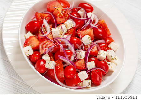 tomato salad with red onion and white cheese tomato salad with red onion and white cheese 111630911