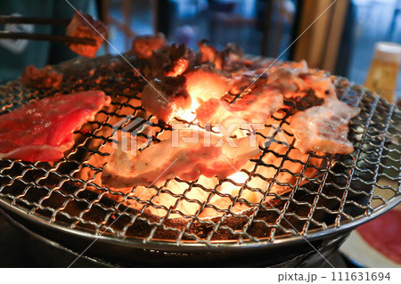 barbecued pork or grilled pork on the broiler 111631694