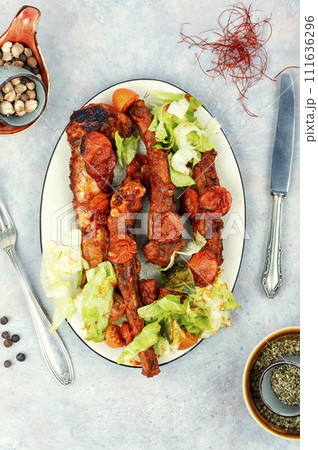 Stewed pork ribs in sauce. 111636296