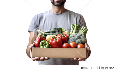 Strong man with a box of fruits and vegetables on a white background 111636762