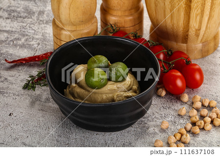 Tasty hummus with green olives 111637108