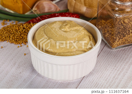 Dijon mustard sauce in the bowl 111637164