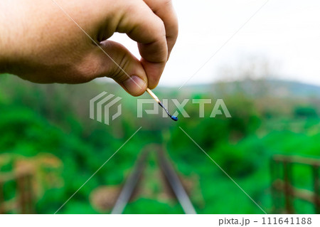 Matches on rails railroad tracks background, fire on railways concept 111641188