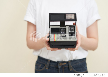 A woman sitting and taking pictures 111643246