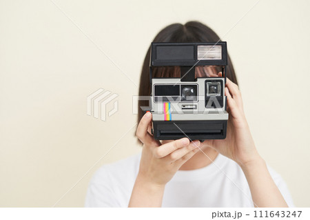 A woman sitting and taking pictures 111643247