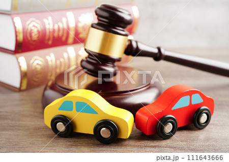 Car accident lawsuit and insurance, Judge hammer with car model. Car accident lawsuit and insurance, Judge hammer with car model. 111643666