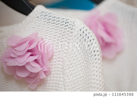White Knitted Fabric with Pink Paper Flower 111645398