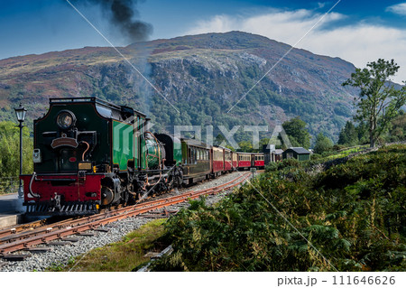 Old Train With Steam Locomotive At Beddgelert Train Station In Snowdonia National Park In Wales, United Kingdom Old Train With Steam Locomotive At Beddgelert Train Station In Snowdonia National Park In Wales, United Kingdom 111646626