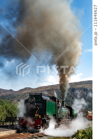 Old Train With Steam Locomotive At Beddgelert Train Station In Snowdonia National Park In Wales, United Kingdom 111646627