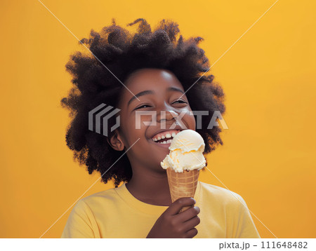 Charming image of a 7-year-old Afro-American girl joyfully eating an ice cream cone, Charming image of a 7-year-old Afro-American girl joyfully eating an ice cream cone, 111648482