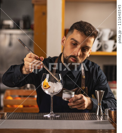 Expert barman is making cocktail Expert barman is making cocktail 111648545
