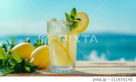 AI-generated content. Fresh lemonade with lemon slices and mint on the beach.  111650148