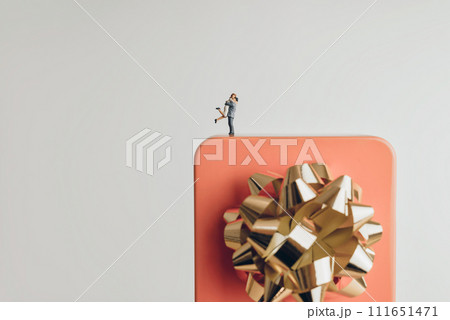 Couple hugging on a giant gift box 111651471